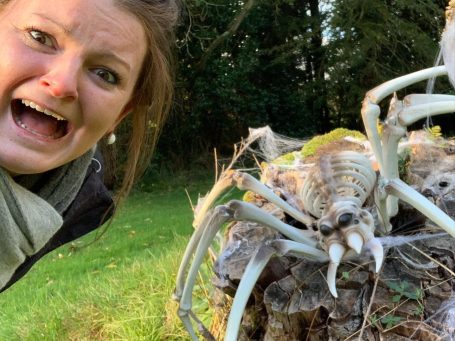 Me, looking quite terrified, next to a giant fake spider. 