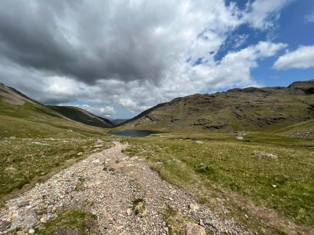 A photograph of Great Gable on a cloudy, sunny day